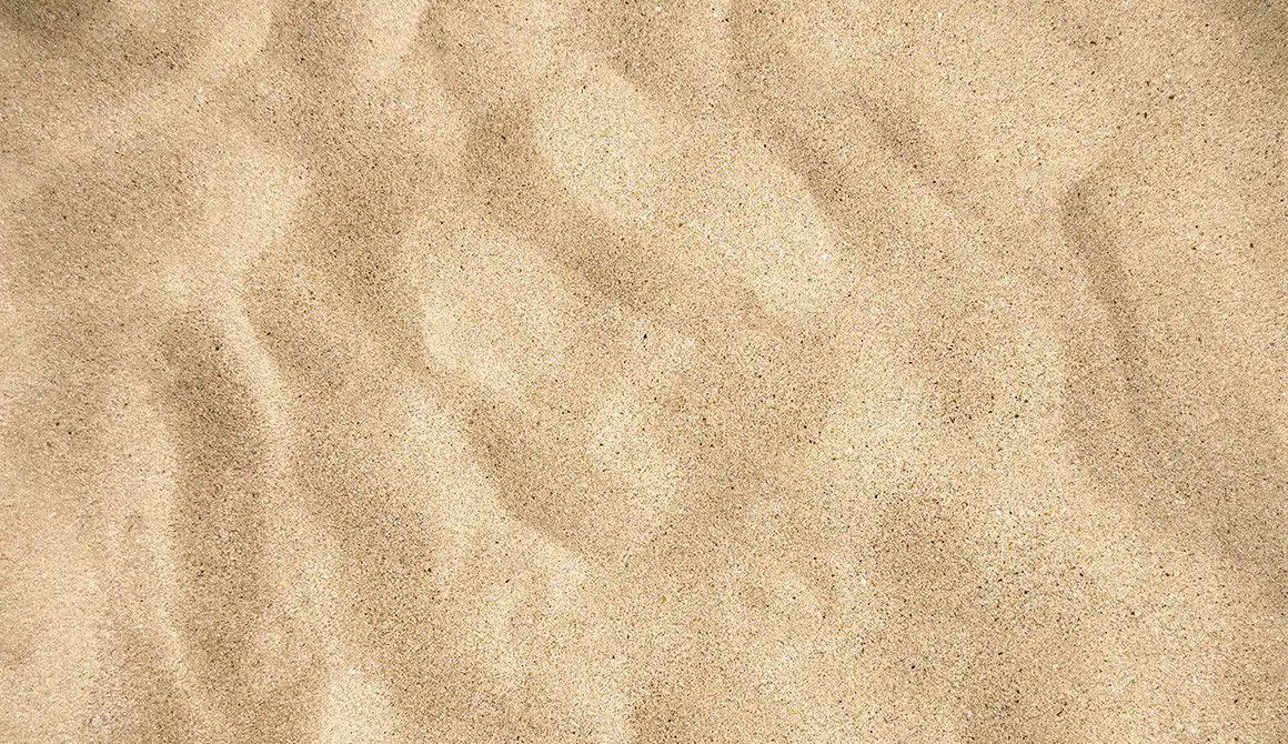 sable-texture Sable doré rappelant les plages ensoleillées